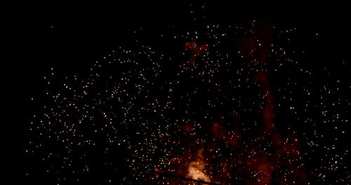 Close-up of firework display against black background