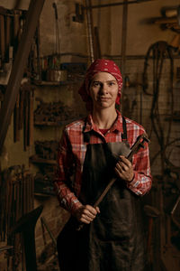 Portrait of blacksmith at workshop
