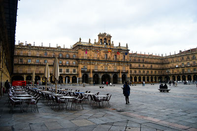 Sidewalk cafe at plaza mayor against clear sky