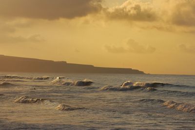 Scenic view of sea against sky during sunset