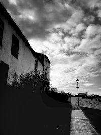 View of road against cloudy sky