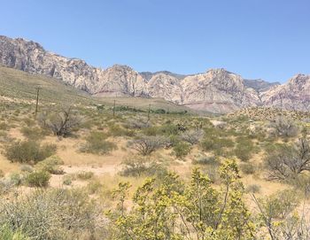 Scenic view of mountains against clear blue sky