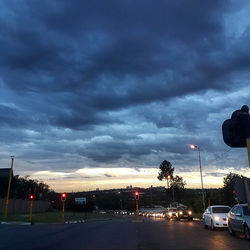 Road passing through dramatic sky