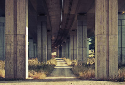 Narrow footpath and highway underpass