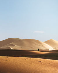 Scenic view of desert against clear sky