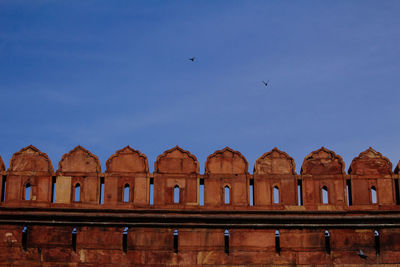 Low angle view of a building against blue sky