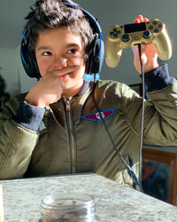 Portrait of smiling boy holding glass