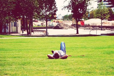 Children playing on grassy field in park