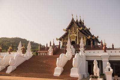 Statue of temple against building