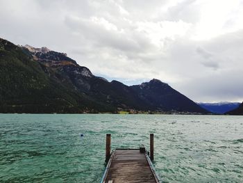 Pier over lake against sky