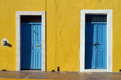 Closed door of yellow building