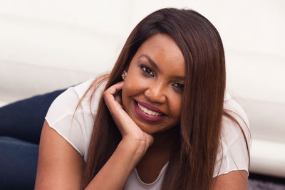 Portrait of smiling young woman at home