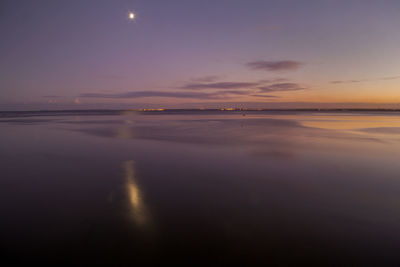 Scenic view of sea against sky at sunset