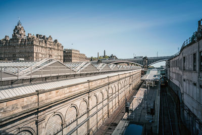 High angle view of bridge and buildings against sky