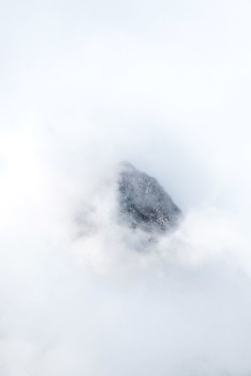 cloud - sky, sky, beauty in nature, no people, scenics - nature, nature, tranquility, tranquil scene, day, low angle view, outdoors, copy space, fog, idyllic, non-urban scene, mountain, cloudscape, white color, fluffy, mountain peak