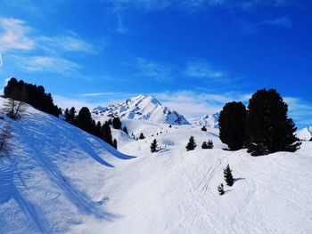 Scenic view of snowcapped mountains against sky