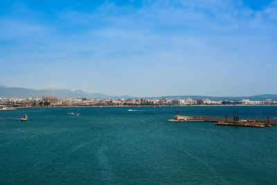 Scenic view of sea against blue sky