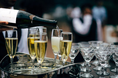 Pouring and serving champagne in a luxury social events like weddings and party.