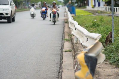 People riding motorcycle on road9-