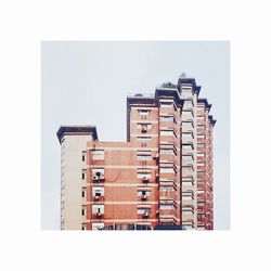 Low angle view of residential buildings against clear sky