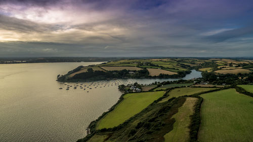 Scenic view of calm sea against cloudy sky