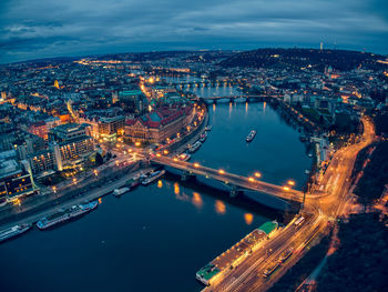 High angle view of illuminated city buildings at night