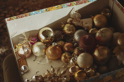High angle view of christmas decorations in box