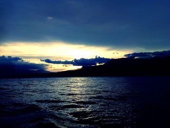 Scenic view of sea against cloudy sky