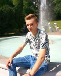 Young man looking at swimming pool