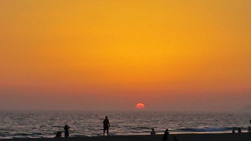 Scenic view of sea at sunset