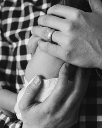 Close-up of couple holding hands