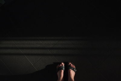 Low section of woman standing on floor