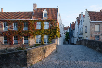 Street amidst buildings against sky