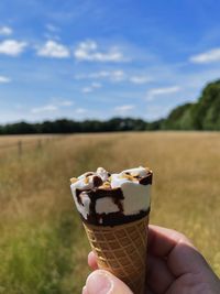 Cropped hand holding ice cream