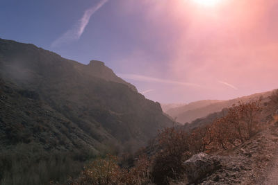 Scenic view of mountains against sky during sunset