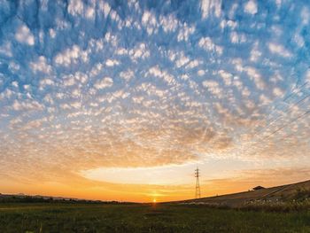 Scenic view of landscape against sky during sunset