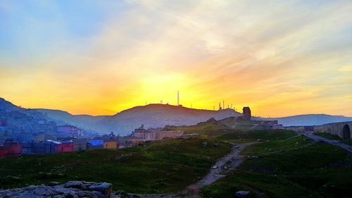 Scenic view of mountains against sky during sunset