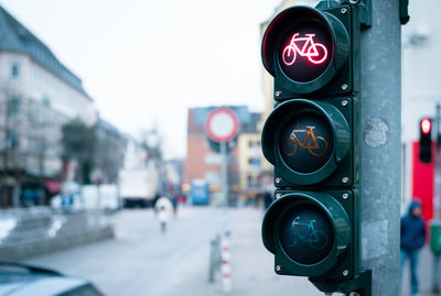 Close-up of bicycle traffic light on street