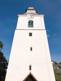 Low angle view of clock tower against sky