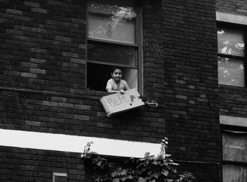 Low angle view of man with toy against wall