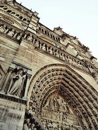 Low angle view of ornate building against sky