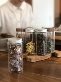 Close-up of ice cream in glass jar on table
