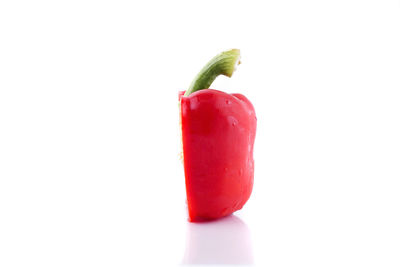 Close-up of red chili peppers against white background