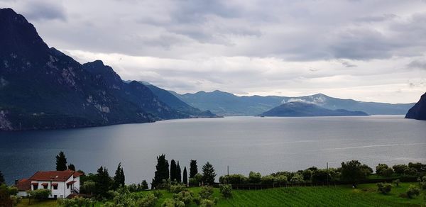 Scenic view of lake and mountains against sky