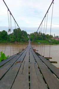 View of footbridge against sky