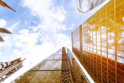 Directly below shot of modern building in city against sky