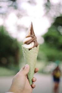 Close-up of hand holding ice cream