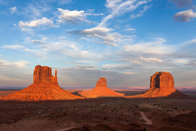 Sunset light on the mittens in monument valley, arizona