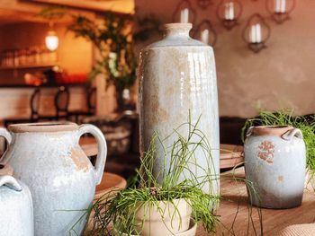 Close-up of urns on table