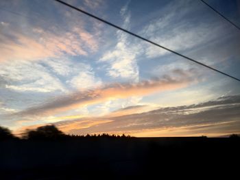 Scenic view of silhouette landscape against sky during sunset